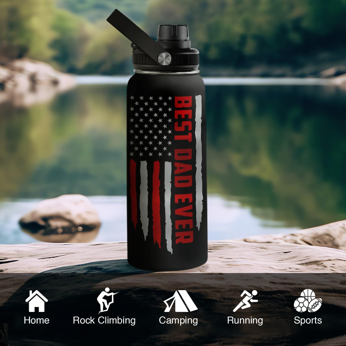 Black water bottle with American flag design and 'Best Dad Ever' text, placed on a rock by a lake.