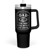 A black 40 oz stainless steel tumbler with a handle and straw lid. The tumbler has white text and graphics including 'DAD' and 'THE MAN THE MYTH THE LEGEND'.