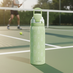 Green water bottle with tennis racket design on a tennis court