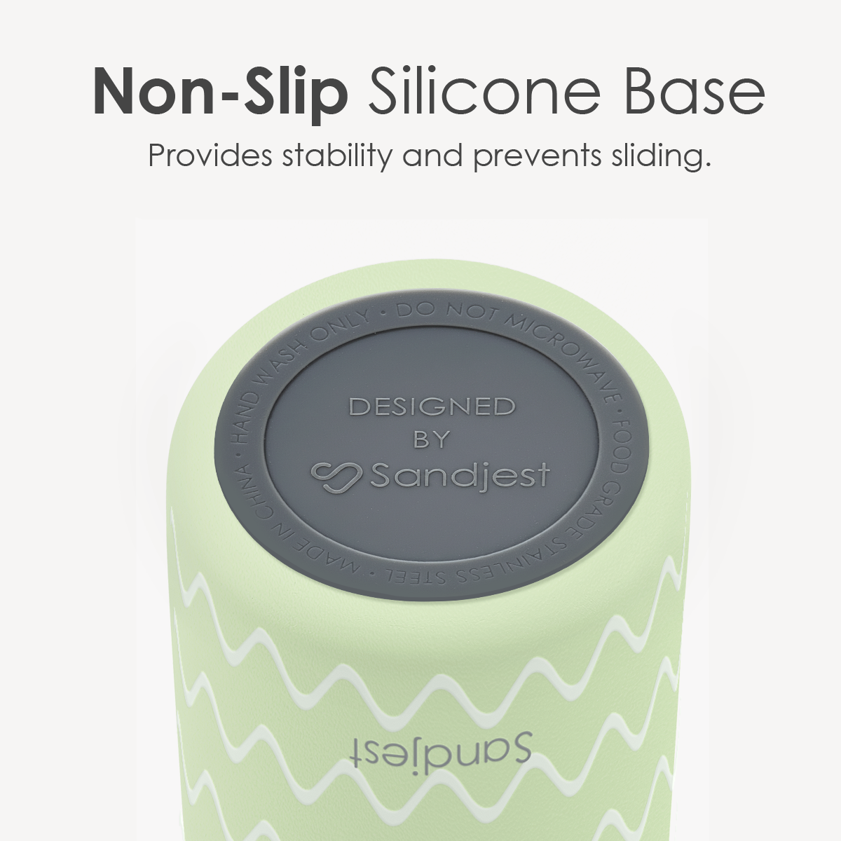 Green roller with gray non-slip silicone base on a white background, featuring Sandjest branding.