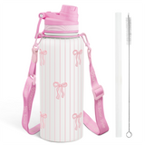 Pink and white water bottle with bow design, strap, and cleaning brush on a white background
