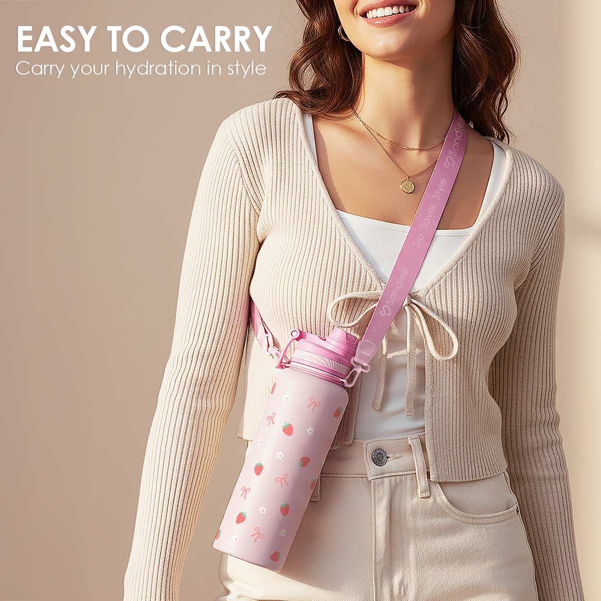 Woman holding a pink water bottle with a strap, featuring text 'EASY TO CARRY'.