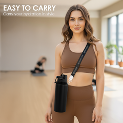 Woman in brown athletic wear holding a black water bottle with a strap, in a gym setting.