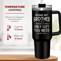 Black travel mug with text and temperature control information on a wooden surface.