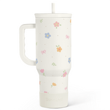 White mug with floral patterns on a white background