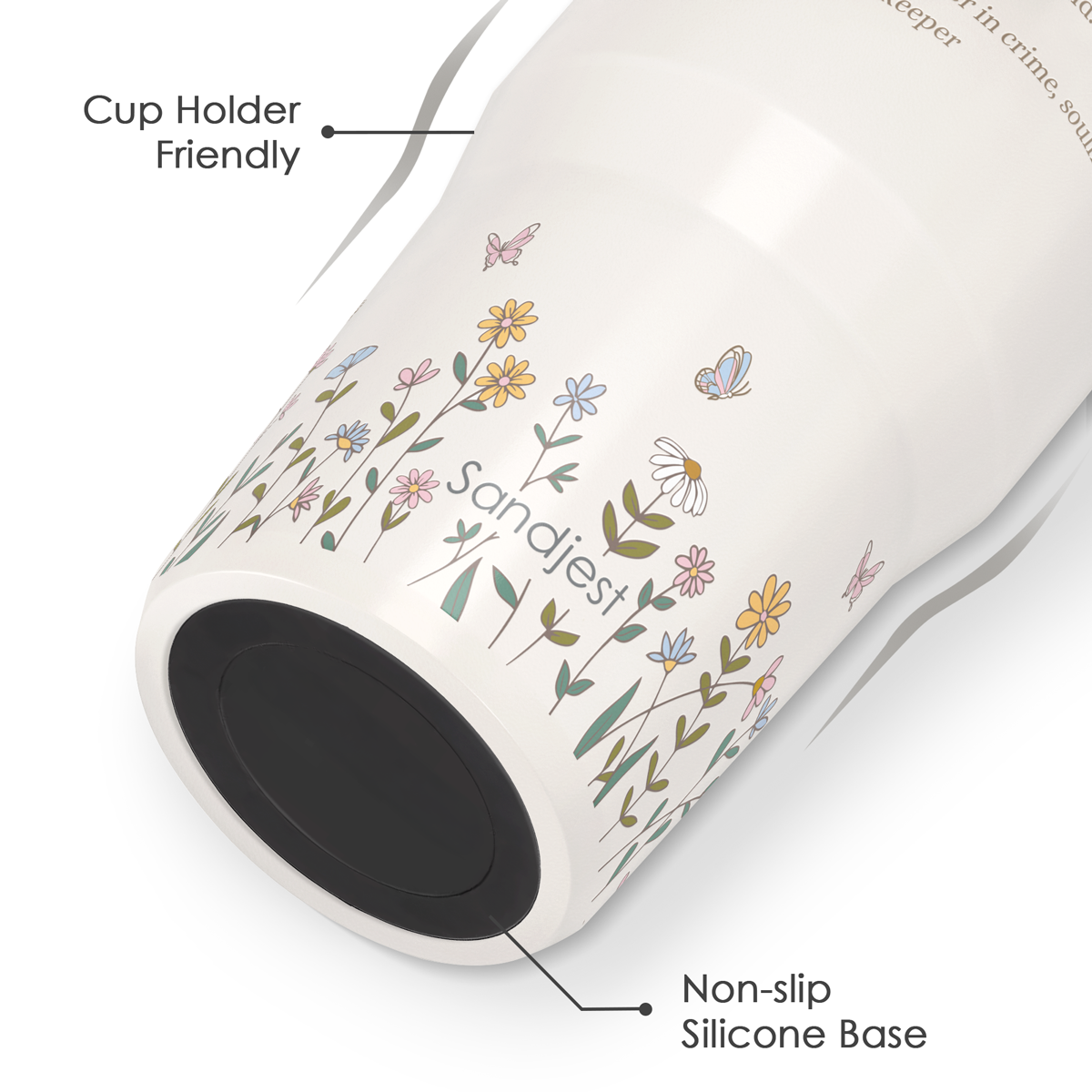 Tumbler with floral design and text indicating features like cup holder friendliness and non-slip silicone base.