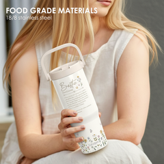 Person holding a white water bottle with floral design and text, labeled 'Food Grade Materials 18/8 stainless steel'.